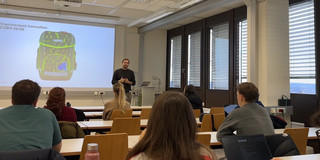 Guest lecturer in front of students